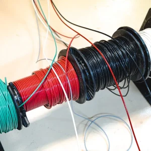 Colored electrical wire spools prepared for a residential solar installation