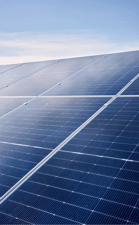 Close-up of solar panels under a clear blue sky