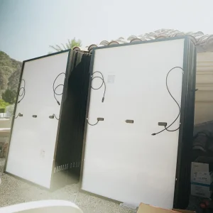 Solar panels staged and ready for rooftop installation at a residential property